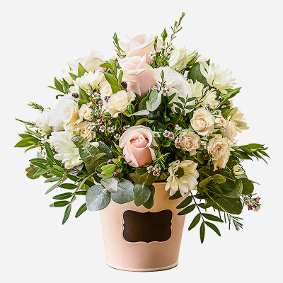 Dawn - An inspiration from nature . A flower gift perfectly arranged in a container using pale shaded flowers and foliage.